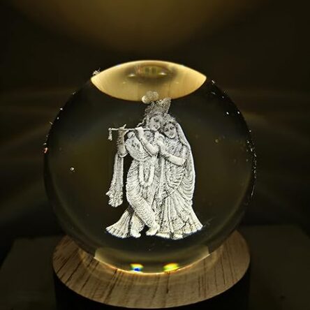Radha Krishna 3D Crystal Ball Warm LED Night Lamp with Wooden Base Modern Brand	ANTORCHE Colour	Radha Krishna Special Feature	Energy Efficient, Relaxing, Eye Care Warm Light, Plug In, Night Lamp Light Source Type	LED See less About this item Radha Krishna Night Lamp: 3D crystal-engraved design that captures the divine aura of Radha Krishna — perfect for your pooja room or home mandir. Warm LED Glow: Soft, soothing light enhances the sacred carving and creates a calming ambiance — perfect for pooja room, bedroom, or meditation corner. Divine Design: Features a beautifully detailed 3D laser engraving of Radha Krishna inside a clear crystal ball – a symbol of love, peace, and spiritual harmony. Spiritual Showpiece for Home or Office: Use it as a centerpiece, temple décor, or peaceful corner lighting — adds meaning wherever placed. Ideal for Gifting: A thoughtful gift option for birthdays, anniversaries, Diwali, or Janmashtami — especially appreciated by parents, elders, and spiritual souls - Image 5
