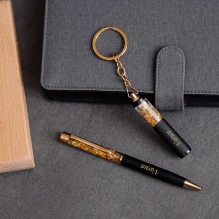Personalized Pen & Keychain Gifts with Name Engraving | Pen for Gifting | Gift Set for Men & Women, Co Brand	blinkNshop Writing instrument form	Ballpoint Pen Colour	Black Ink Colour	Black Age Range (Description)	Adult About this item PRODUCT DETAILS:- Material: Metallic || Color: Black & Golden || Item Dimension: 3.25 x 6.25 Inch || Package Contain: Pack of 2 || To Customise Your Gold Flake Set Contact The Seller Trough "Seller Messaging Assistant" Under the 'Buyer-Seller Messaging Service. PRODUCT INCLUDED:- Customized gift set with pen with a keychain with your name Engraved on it. FOR GIFT:- Office Supplies, Corporate , anniversary gift, etc. Versatile Use: Ideal for on-the-go writing needs or as an emergency pen. Dual Functionality: Serves as both a reliable writing tool and a handy keychain accessory.rporate Gift Set, Customized Birthday Gift for Husband/Boyfriend/Brother/Wife - Image 2